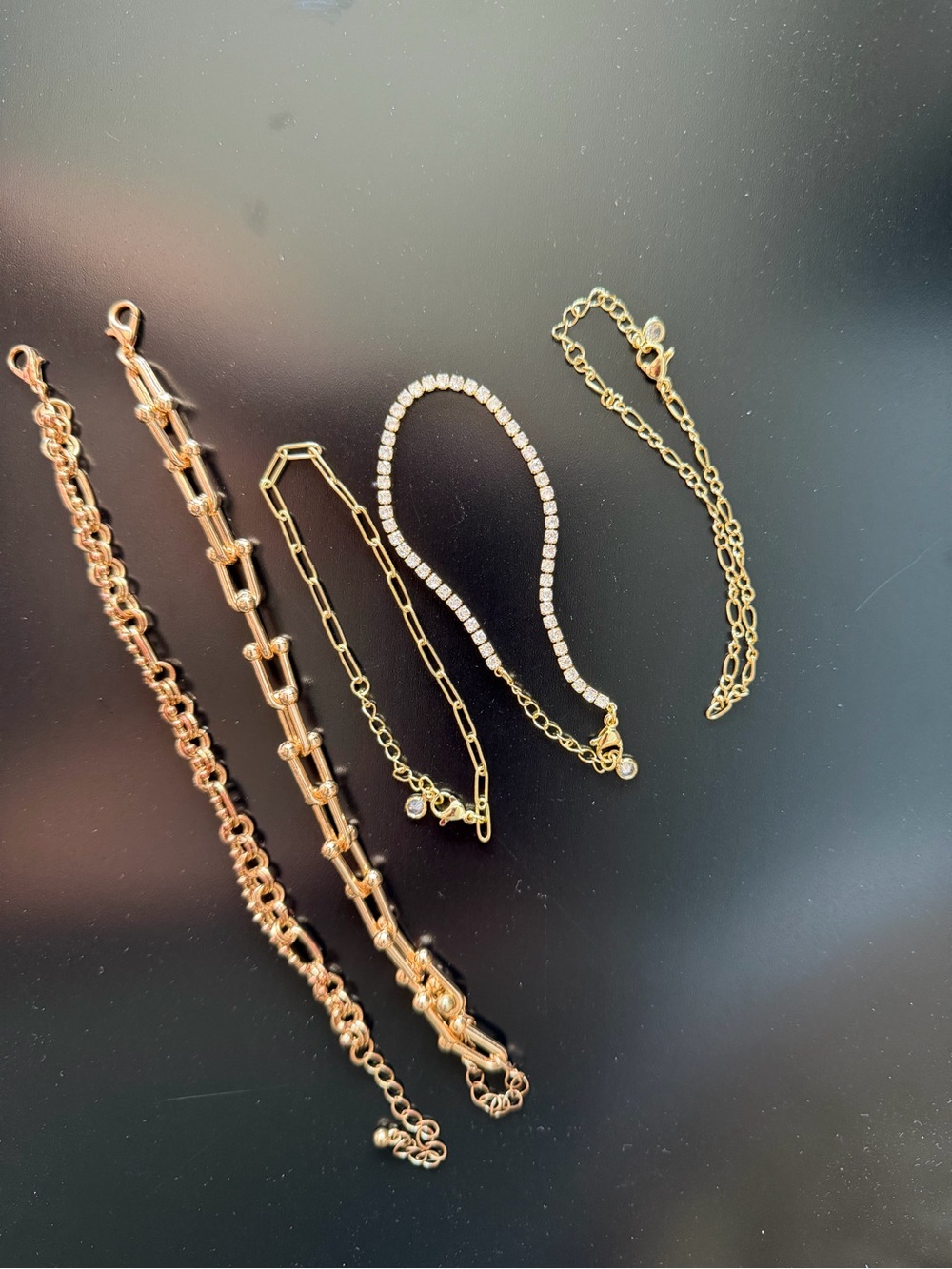 Bundle of 5 gold toned bracelets